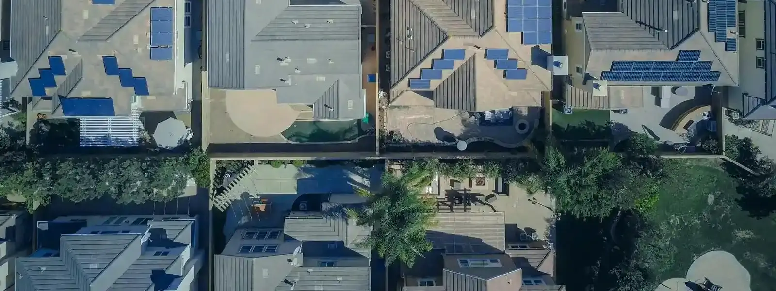 aerial view of houses with solar panels